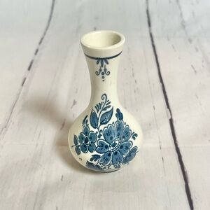 Hand-painted Delft Blue mini bud vase with a floral motif, made in Holland